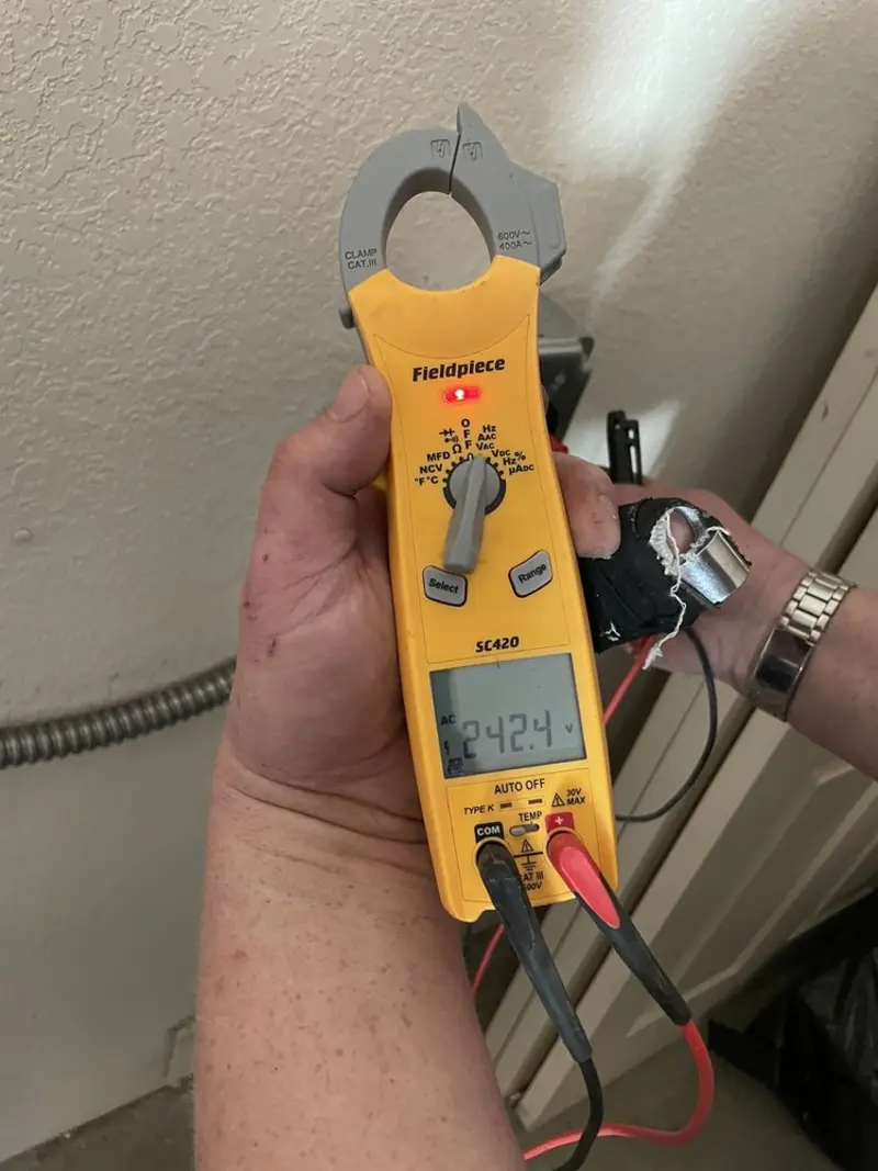 Voltage testing with clamp meter during Electrical Installation Services in Cumberland